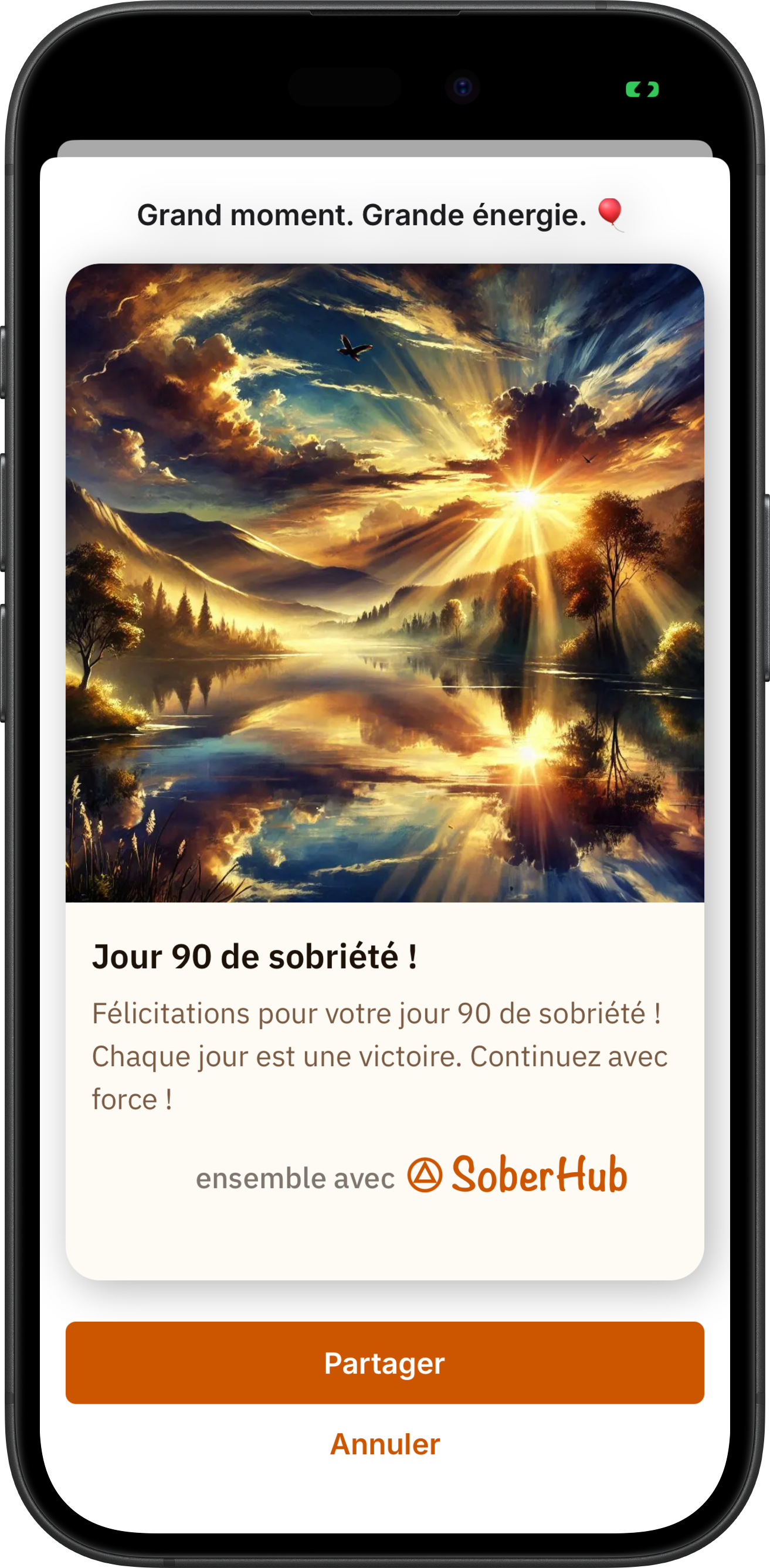 La carte qu'ouvre une notification de jalon dans SoberHub : Grand moment. Grande énergie., une photo de paysage et Jour 90 de sobriété, avec Partager et Annuler